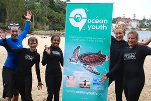 Ocean Youth Group Beach Shot With Banner