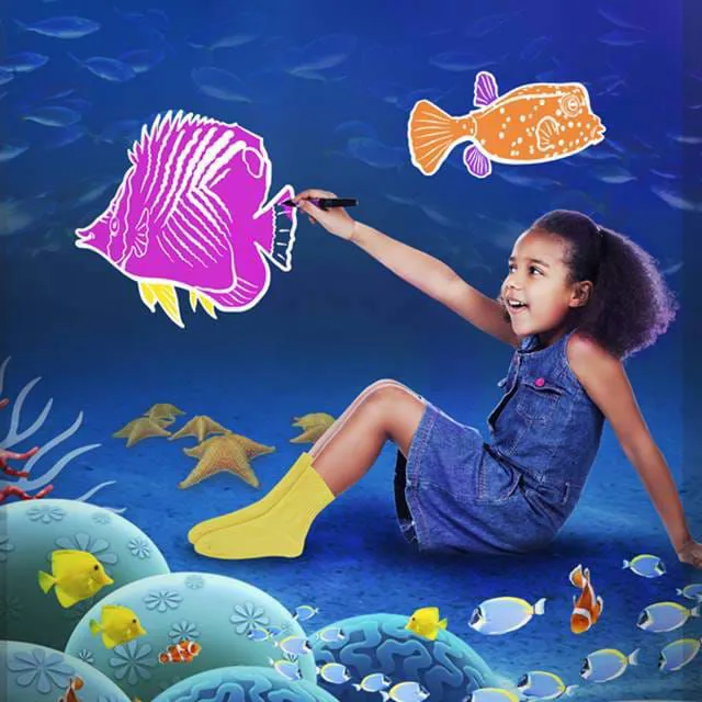 Child coloring a fish in Doodle Reef