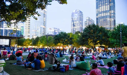 Families enjoying a movie at Klyde Warren Park