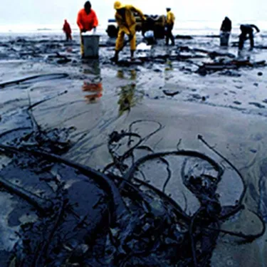 Some men cleaning up an Oil Spill