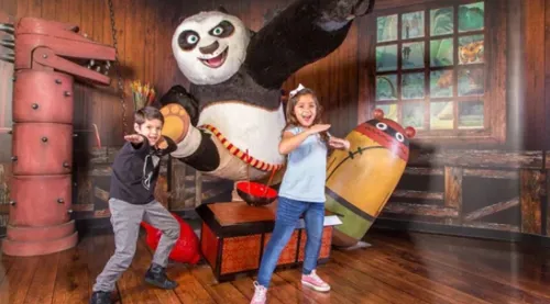 Kung Fu Panda posing with kids at Madame Tussauds Orlando
