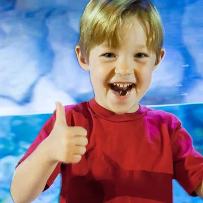Kid Smiling Thumbs Up (1)