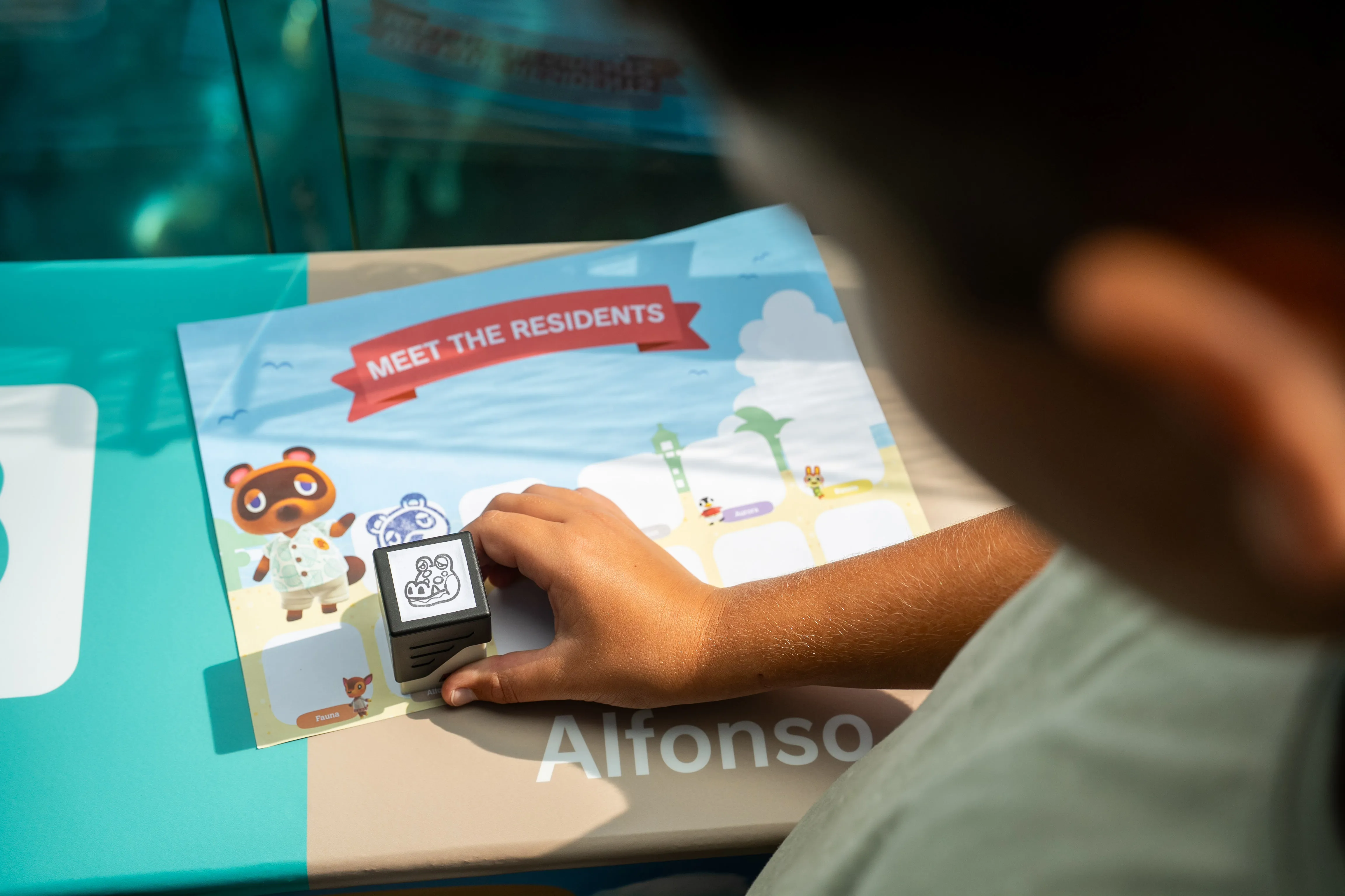 Guest stamping animal crossing characters at SEA LIFE Sunshine Coast