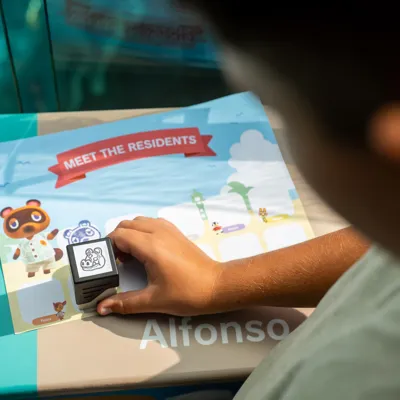 Guest stamping animal crossing characters at SEA LIFE Sunshine Coast