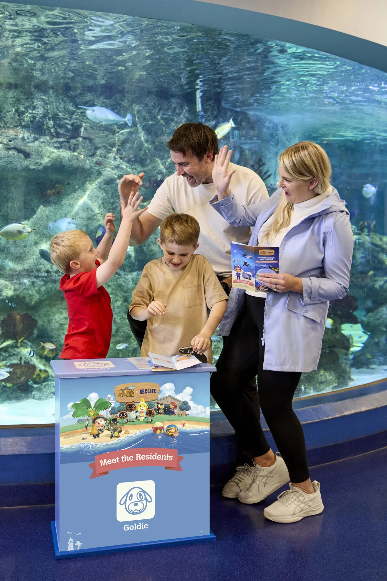 Guests using the Animal Crossing New Horizons stamping station